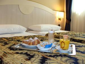 Een bed of bedden in een kamer bij Hotel Belforte