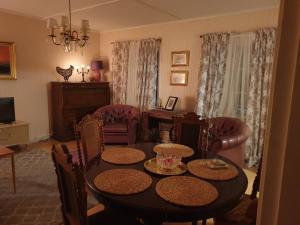 a dining room with a table and chairs at Katariinan Kamari in Raahe