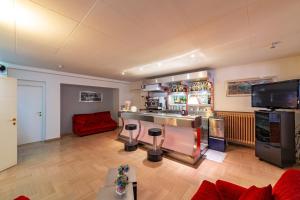 TV a/nebo společenská místnost v ubytování Hotel Corallo