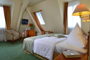 Voodi või voodid majutusasutuse City Partner Hotel Holländer Hof toas