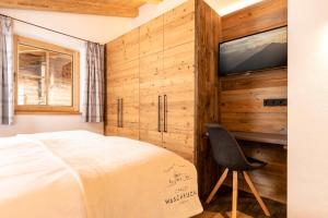Łóżko lub łóżka w pokoju w obiekcie Chalet Waschkuchl