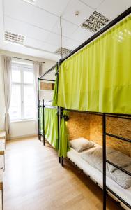 Posteľ alebo postele v izbe v ubytovaní Avenue Hostel