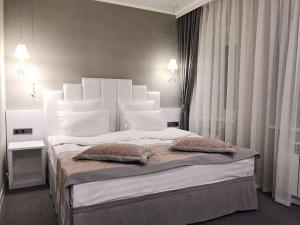 Кровать или кровати в номере Lazurit Inn