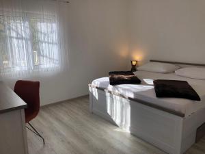 Posteľ alebo postele v izbe v ubytovaní Apartments Vedran