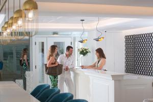 a group of people standing around a counter at Mari Kristin Beach Hotel in Hersonissos