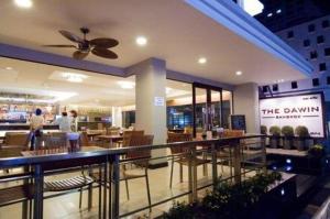 A restaurant or other place to eat at The Dawin Hotel