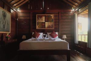Giường trong phòng chung tại Dukuh Baturan Villa