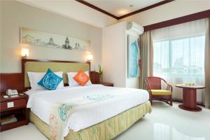 Postel nebo postele na pokoji v ubytování Hotel Sahid Surabaya
