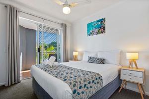 a bedroom with a bed and a large window at Dockside Apartments Mooloolaba-Pool renovation from 1st of June-12th of August in Mooloolaba +57 photos