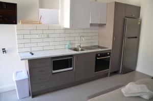 Kuchyň nebo kuchyňský kout v ubytování Manly Beach Guesthouse