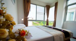 Ένα ή περισσότερα κρεβάτια σε δωμάτιο στο The Meet Green Apartment