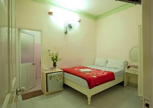 Giường trong phòng chung tại Hải Uyên