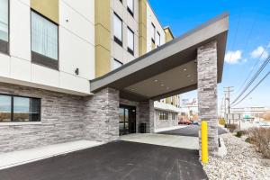 a rendering of a building with a driveway at Best Western Plus Philadelphia-Pennsauken Hotel in Cherry Hill