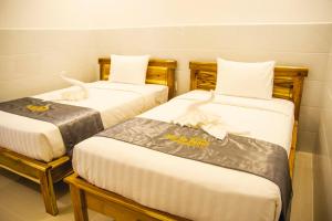 Postel nebo postele na pokoji v ubytování Mui Ne Beach Hotel