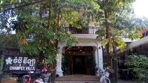 a building with a sign in front of it at Champey Villa in Siem Reap