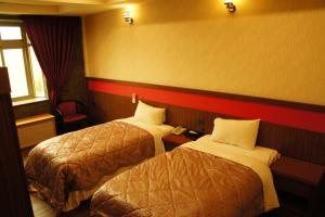 Кровать или кровати в номере Paris Motel