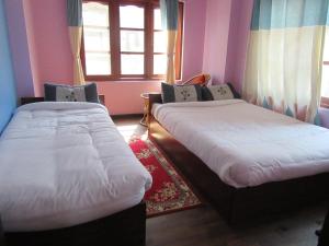 Letto o letti in una camera di STUPA VIEW INN
