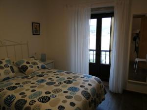 Postel nebo postele na pokoji v ubytování Casa rural Camelle Casa dos avós