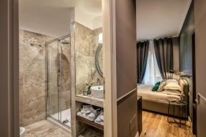 a bathroom with a shower and a sink at Tree Charme Parliament Boutique Hotel in Rome +126 photos