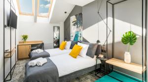 Posteľ alebo postele v izbe v ubytovaní Camera Apartments