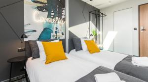Posteľ alebo postele v izbe v ubytovaní Camera Apartments