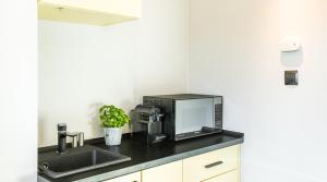 Kuchyňa alebo kuchynka v ubytovaní Camera Apartments