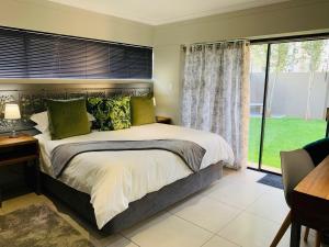 Katil atau katil-katil dalam bilik di Welgemeendt Accommodation