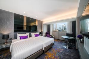 Una cama o camas en una habitación de Hotel JAL City Bangkok