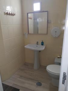a bathroom with a sink and a toilet at Hostel Malaga Inn in Torremolinos