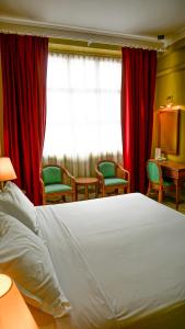 Hotel UiTM Shah Alam tesisinde bir odada yatak veya yataklar