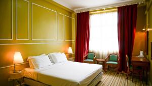 Hotel UiTM Shah Alam tesisinde bir odada yatak veya yataklar