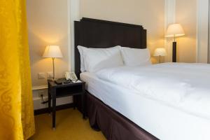 Un pat sau paturi într-o cameră la Hotel Euler Basel