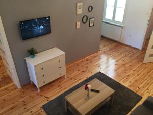 Televízia a/alebo spoločenská miestnosť v ubytovaní Apartamenty Szabla Bydgoszcz
