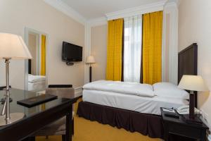 Un pat sau paturi într-o cameră la Hotel Euler Basel