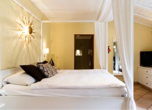 Un pat sau paturi într-o cameră la Albergo Losone