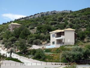 a house on the side of a hill at Thassos Grand Resort in Alyki
