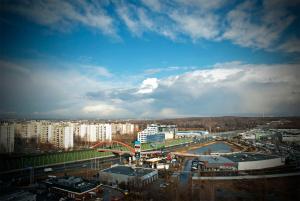 a view of a city with a bridge and buildings at Quality Silesian Hotel in Katowice