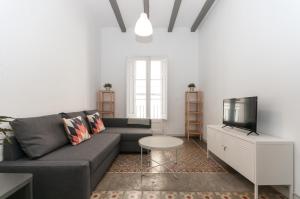 Posezení v ubytování Gopal-Comfortable Cozy Apartment for Groups in Gracia