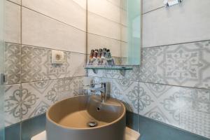 a bathroom with a sink and a mirror at Cretan Berry Portou in Chania +26 photos
