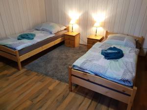 
Ein Bett oder Betten in einem Zimmer der Unterkunft Dudu's Gästehaus
