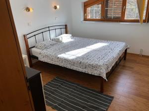 a bedroom with a bed and a window at Apartments Lukas in Medulin