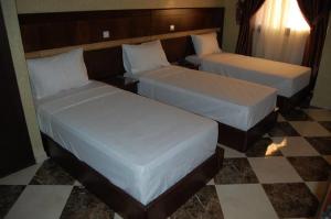 Vuode tai vuoteita majoituspaikassa Hotel AMOUDOU فندق أمودو