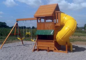 a playground with a slide and a swing at Penzion Kundratice in Kundratice