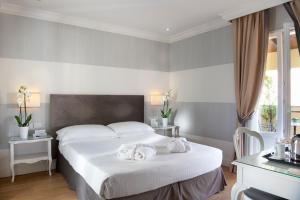Voodi või voodid majutusasutuse Hotel Rapallo toas