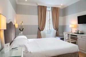 Voodi või voodid majutusasutuse Hotel Rapallo toas