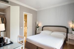 Voodi või voodid majutusasutuse Hotel Rapallo toas