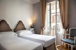Voodi või voodid majutusasutuse Hotel Rapallo toas