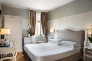 Voodi või voodid majutusasutuse Hotel Rapallo toas