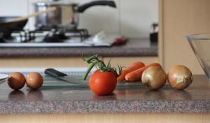 a group of vegetables on a counter in a kitchen at Mount Waverley Townhouses in Mount Waverley