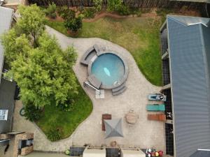an overhead view of a swimming pool in a yard at The Featherbed - Oudtshoorn in Oudtshoorn